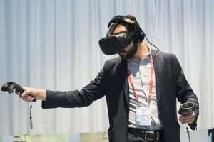 Congress attendee tries out a VIVE virtual reality headset on day 1 of the Mobile World Congress 2016, Fira Gran Via - Barcelona