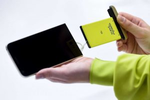 A hostess shows a new LG G5 model of South Korean multinational conglomerate corporation LG during a press conference on the eve of the official start of the Mobile World Congress in Barcelona on February 21, 2016. The world's biggest mobile fair, Mobile World Congress, helds from February 22 to February 25. / AFP / JOSEP LAGO